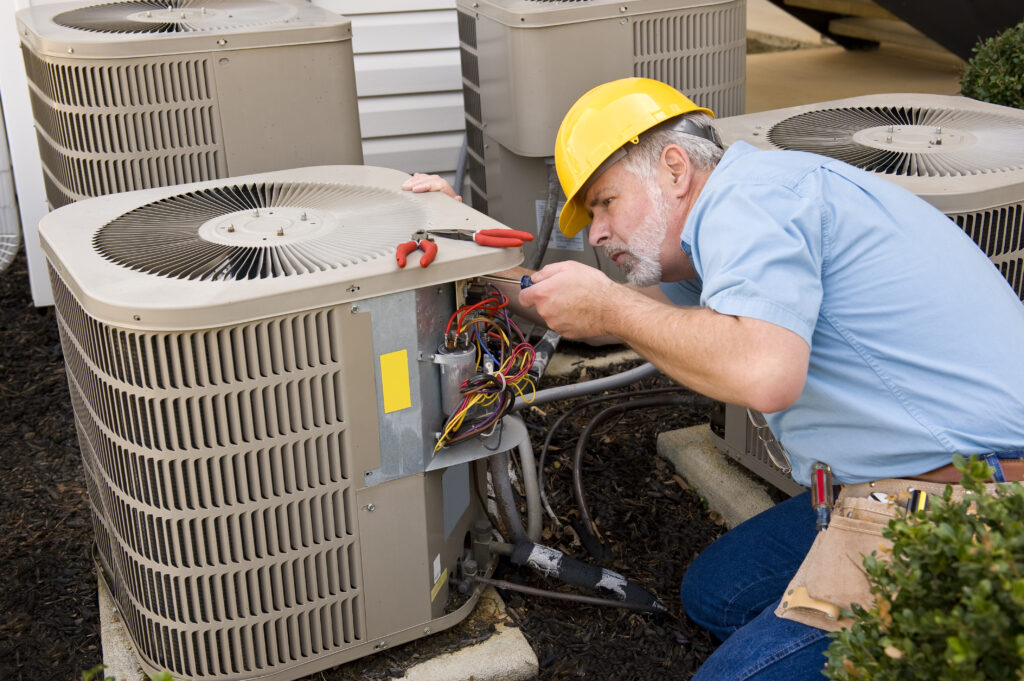 man working on hvac system